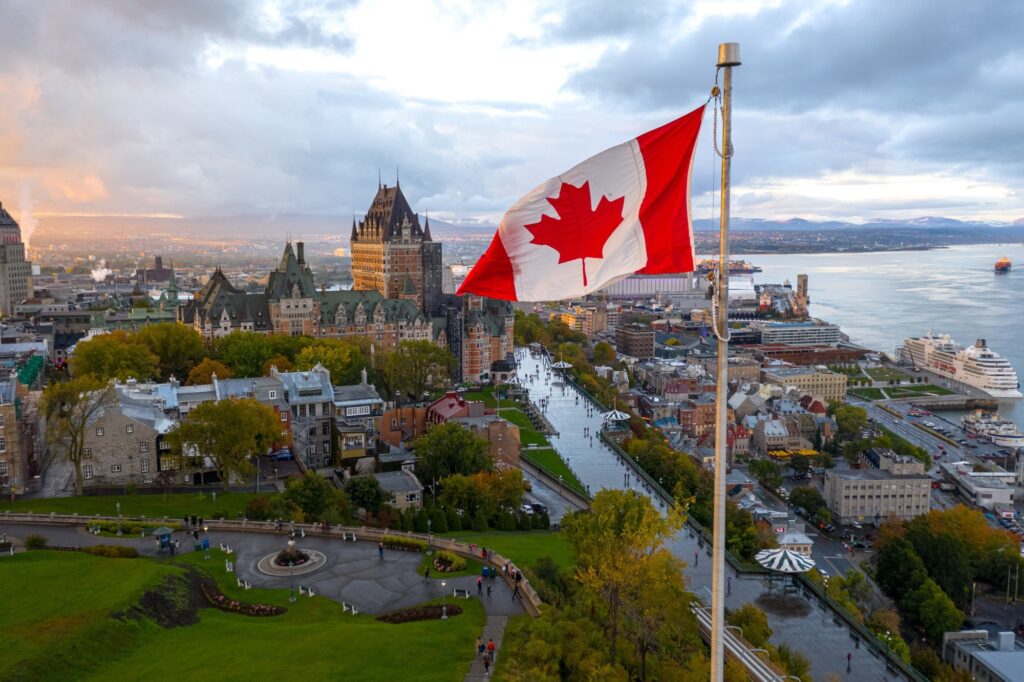 canadian flag in quebec flying high