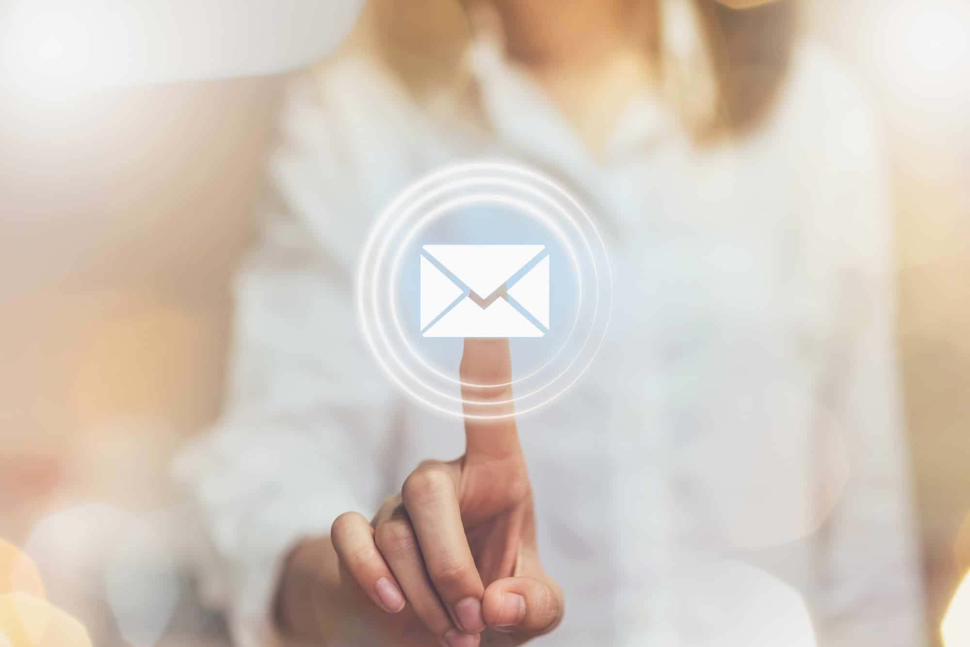 hand of business woman pressing button icon email
